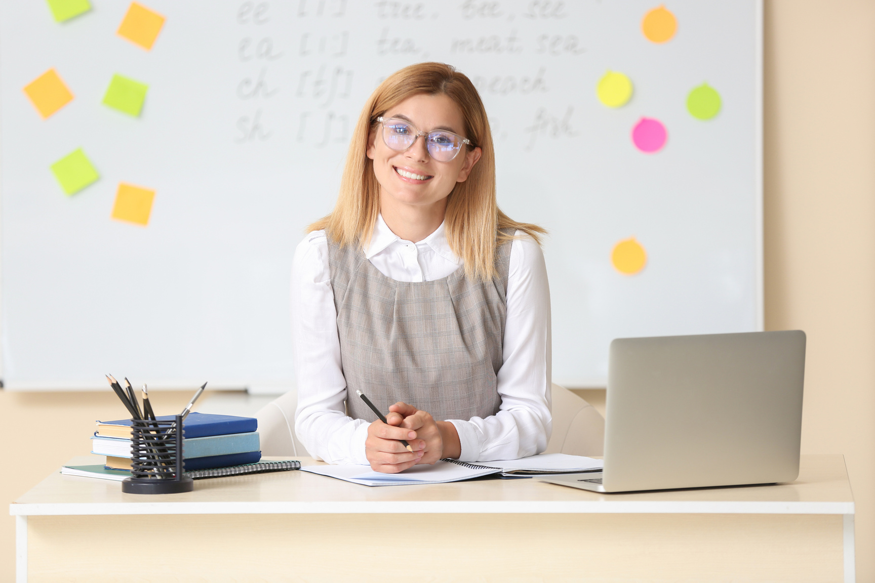 Beautiful Female Teacher in Classroom